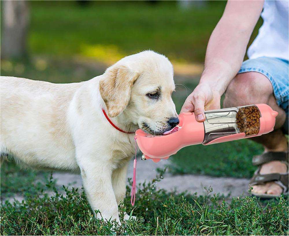 portable pet water bottle feeder and garbage bag storage in 1